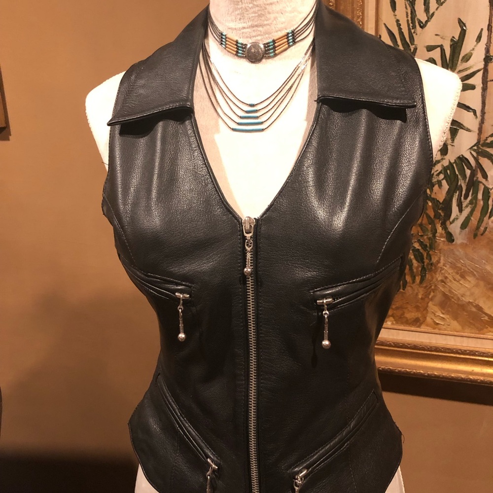This is an easy Rider black leather vest Size medium and in brand new condition.